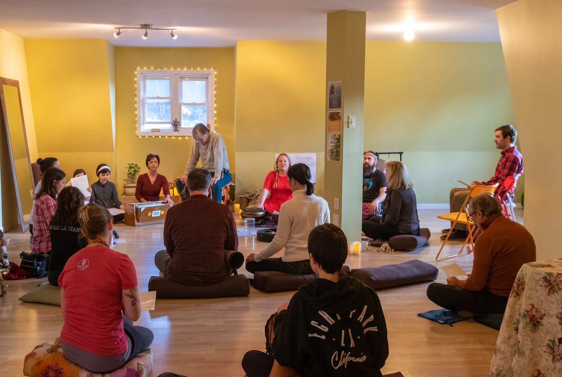 SOULHUM leading a kirtan circle in a home studio