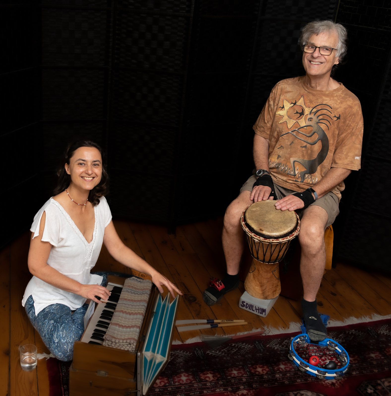 Zofia with harmonium and Scot with djembe — the SOULHUM duo